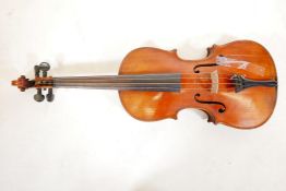 A late C19th/early C20th violin in ebonised wood case, no label, one piece back, split to front, and