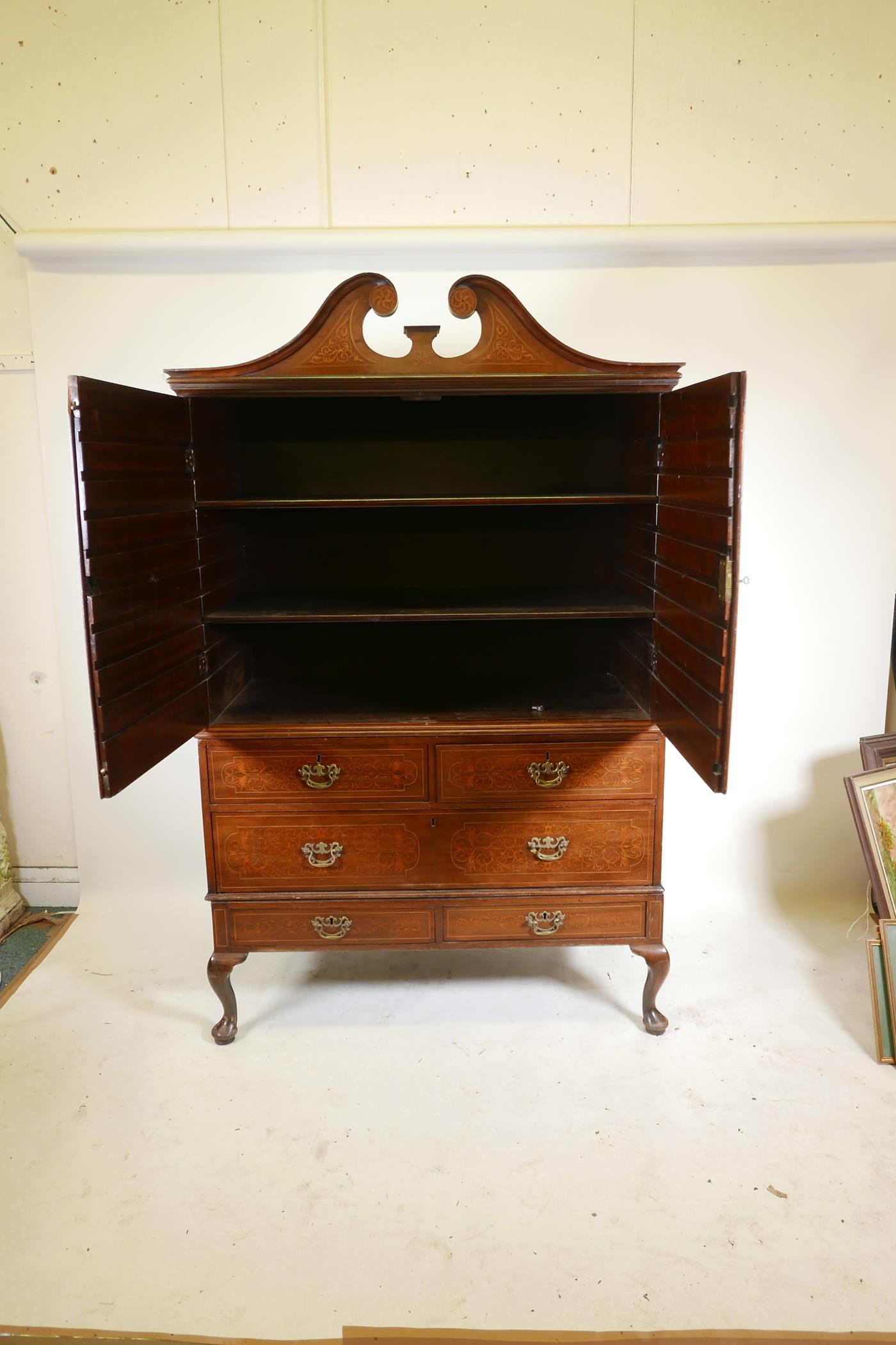 A C19th plum pudding mahogany press cupboard, with inlaid seaweed panel panels, the upper section - Image 5 of 5