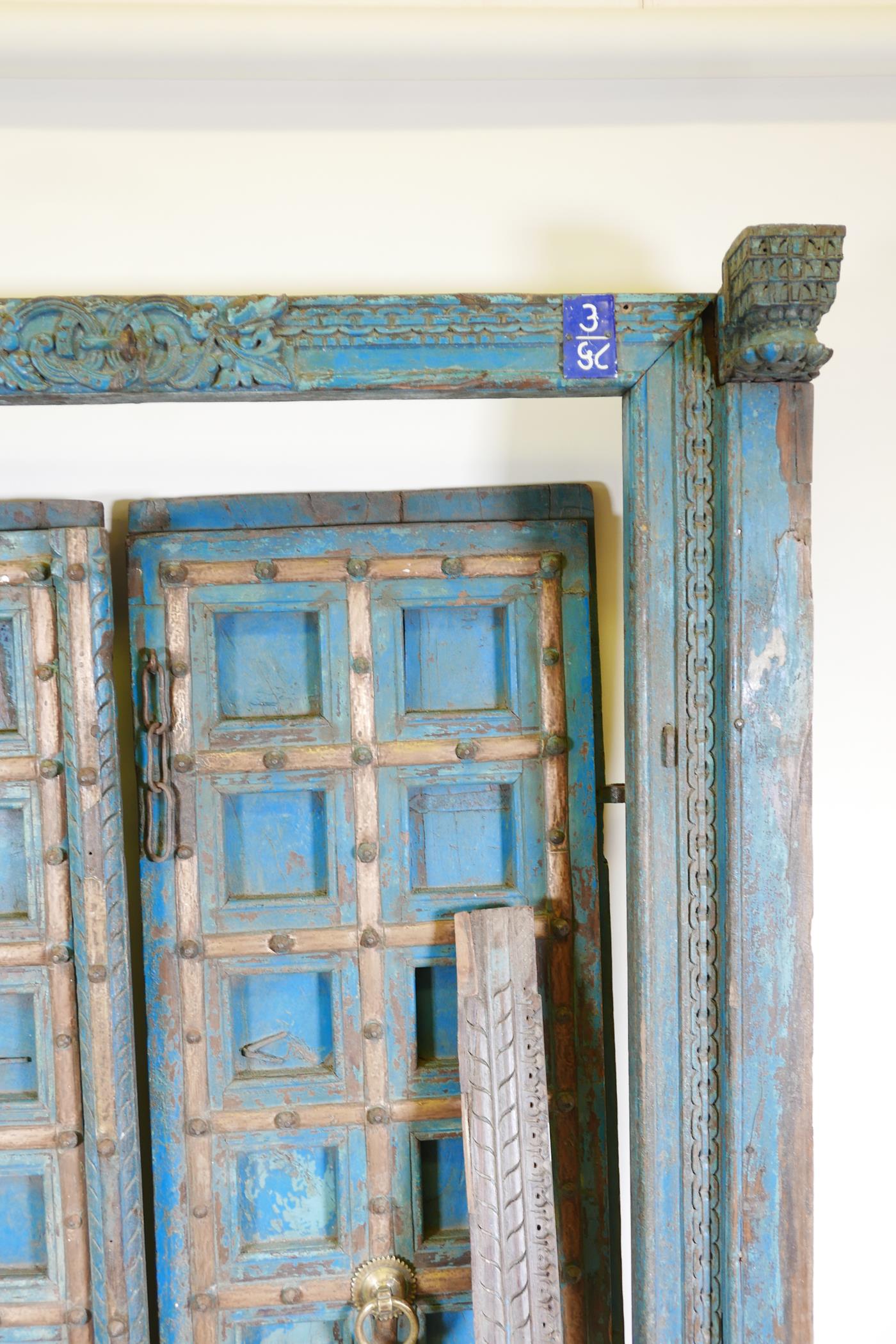 Architectural salvage: A pair of Indian hardwood panelled storm doors, with brass sheathed iron - Image 8 of 12