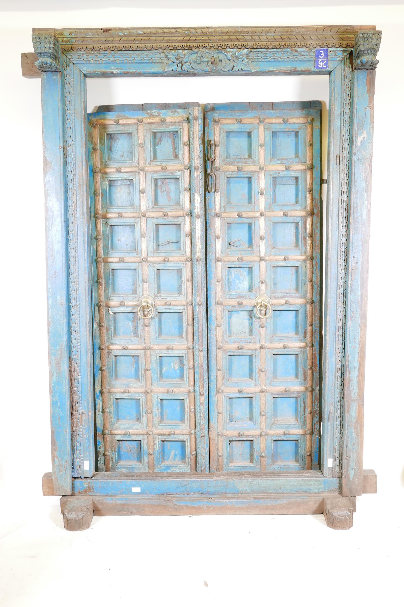 Architectural salvage: A pair of Indian hardwood panelled storm doors, with brass sheathed iron - Image 2 of 12