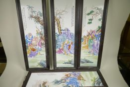 A set of four Chinese porcelain wall plaques decorated with figures and animals in bright enamels,