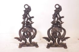 A pair of early C19th cast iron fire dogs, 13" x 20" x 21"