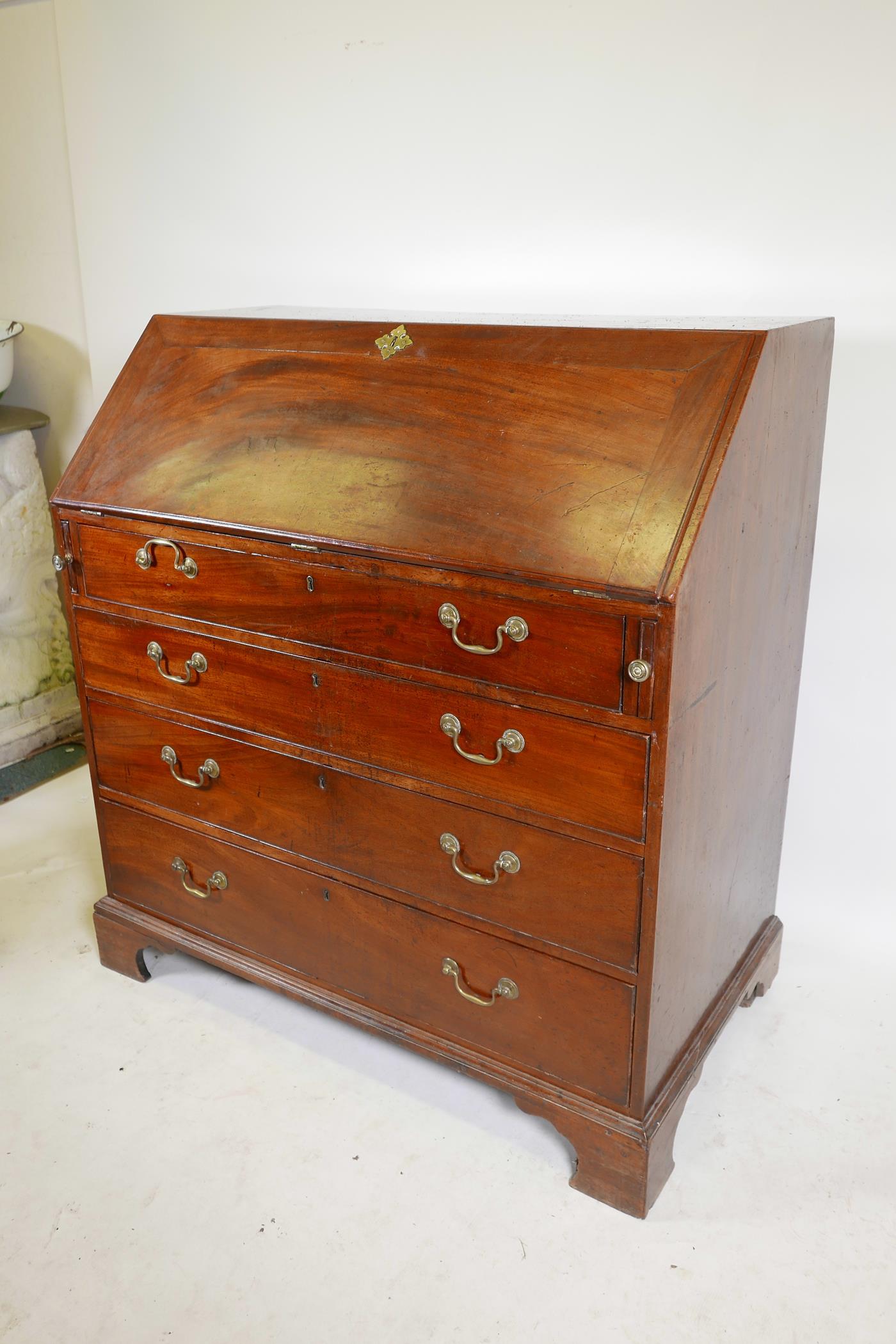 A Georgian mahogany fall front bureau, the fitted interior with secret drawer and slides over four - Image 2 of 5