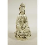 A Chinese blanc de chine porcelain figure of Quan Yin seated on a lotus throne, impressed marks