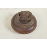 A Japanese wood trinket box, the cover carved as a dragon, 2¾" diameter