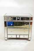 A contemporary mirror glass chest of two over four drawers, A/F glass cracked on three drawers,