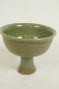 A Chinese celadon glazed porcelain stem bowl, 4½" high, 5½" diameter