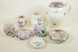 Eight pieces of decorative Poole Pottery including water jug and lidded jam pot