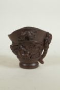 A Chinese carved bamboo libation cup decorated with climbing kylin, seal mark to base, 3" high