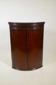 A Georgian mahogany hanging corner cupboard, 18" x 182, 38" high