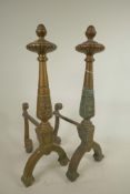 A pair of C19th brass fire dogs of classical style, 18" high, 8" deep