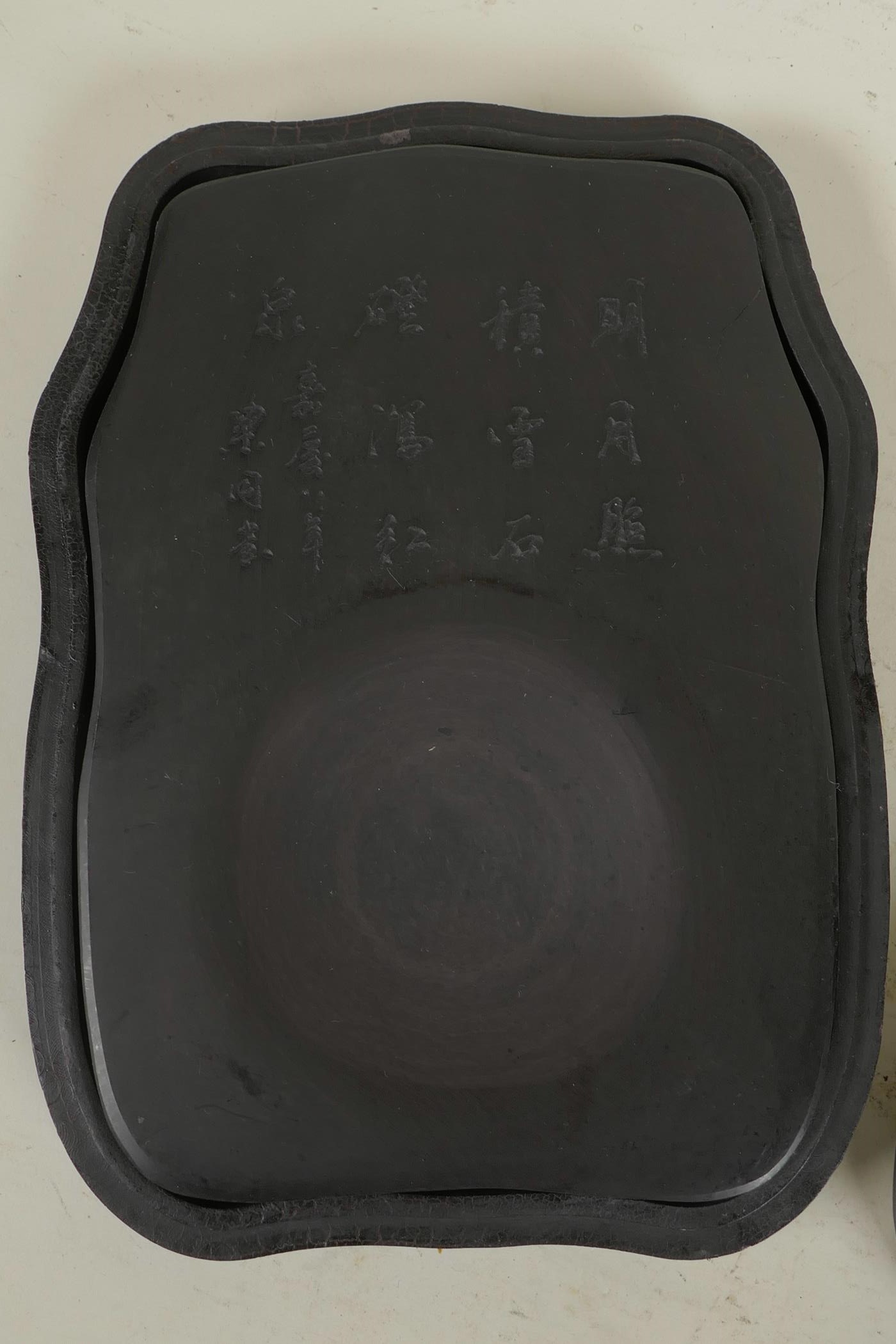 A Chinese ink stone with engraved character inscription, in a lacquer box with mother of pearl style - Image 2 of 3