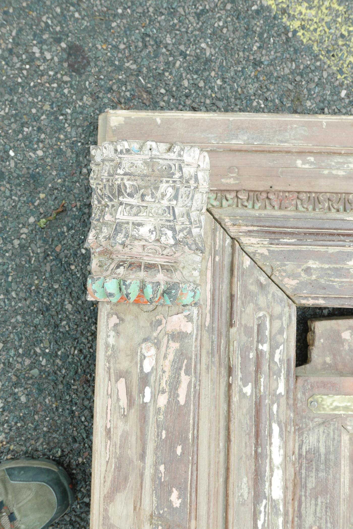 Architectural salvage: A pair of Indian teak storm doors and frame, with carved details, each door - Image 2 of 6