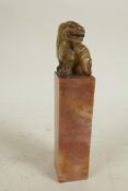 A square section Chinese carved soapstone seal, the top carved as a fo dog, 6" high