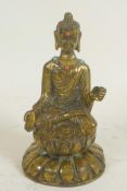 A small Chinese brass figurine of Buddha seated in meditation embellished with turquoise and coral