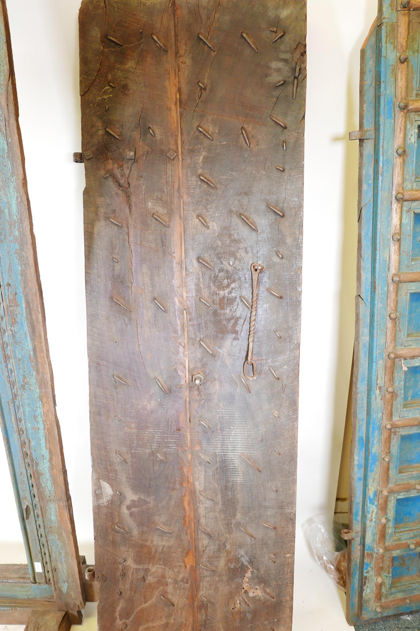 Architectural salvage: A pair of Indian hardwood panelled storm doors, with brass sheathed iron - Image 11 of 12