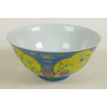 A Chinese porcelain bowl with blue glaze and floral panels, red seal mark to base, 6" diameter