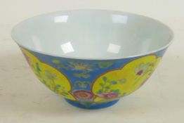 A Chinese porcelain bowl with blue glaze and floral panels, red seal mark to base, 6" diameter