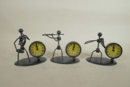 A set of three metal figural desk clocks in the form of musicians, 4½" high