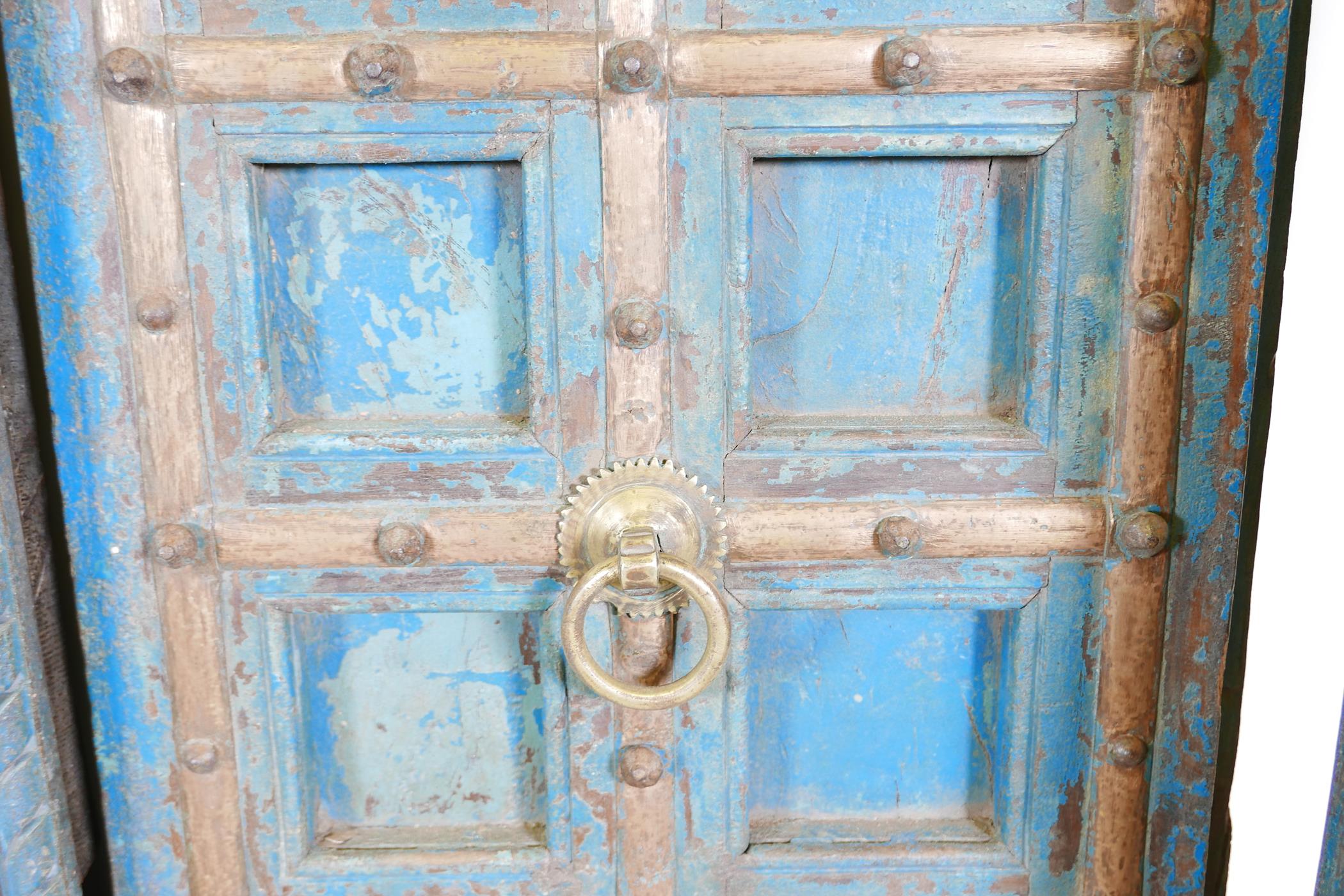Architectural salvage: A pair of Indian hardwood panelled storm doors, with brass sheathed iron - Image 3 of 12