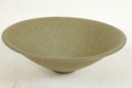 A Chinese celadon porcelain bowl, the interior embossed with figures, 7¼" diameter