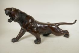 A Japanese bronze figure of a tiger, 25" long