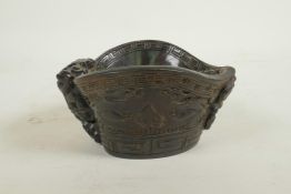 A Chinese horn and imitation horn libation cup with carved kylin decoration, carved seal mark to