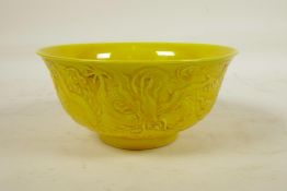 A Chinese yellow ground rice bowl with raised dragon decoration, 6 character mark to base, 6"