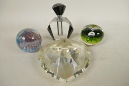 Two studio glass paperweights together with a large heart shaped pyramid paperweight and an Art Deco