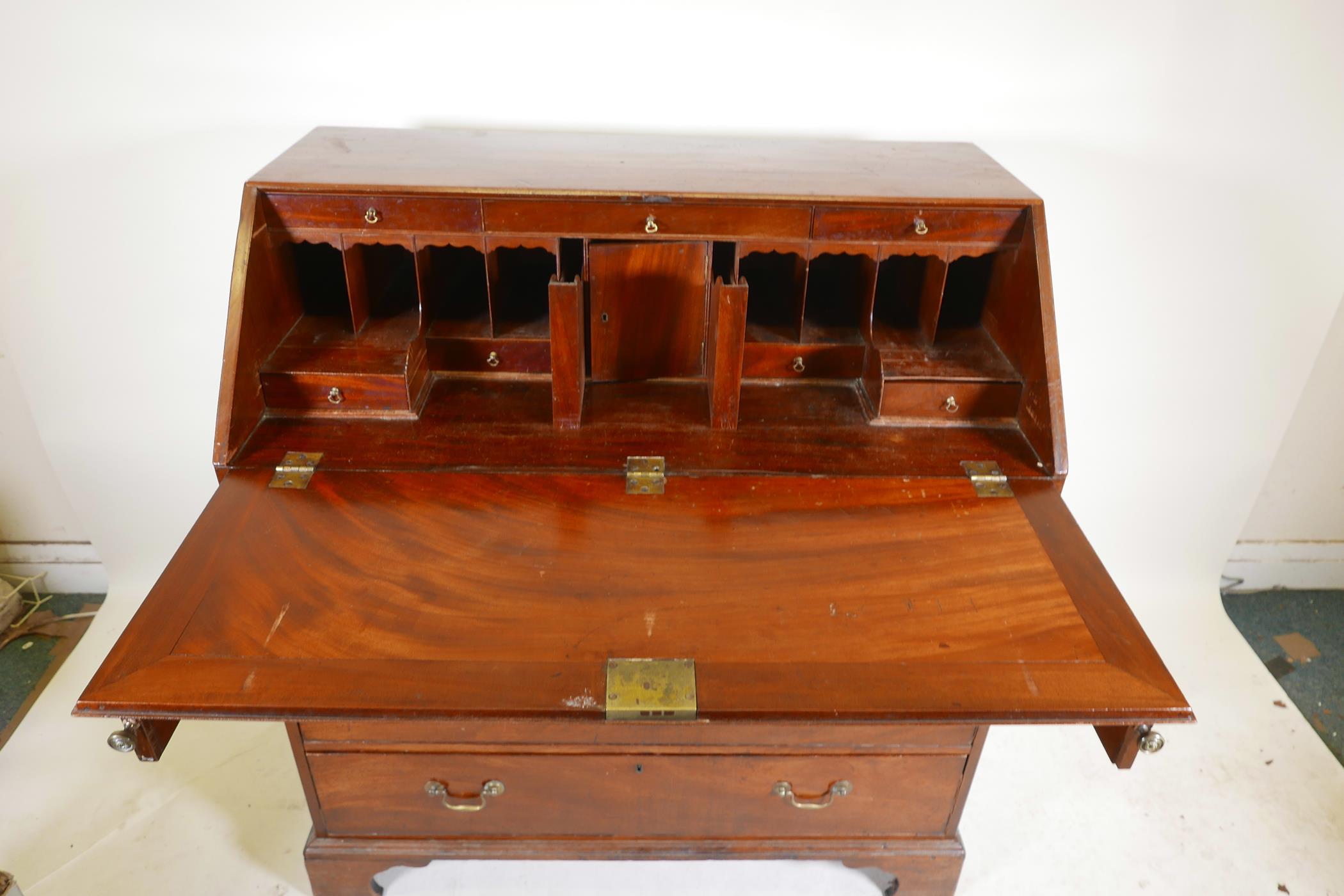 A Georgian mahogany fall front bureau, the fitted interior with secret drawer and slides over four - Image 5 of 5