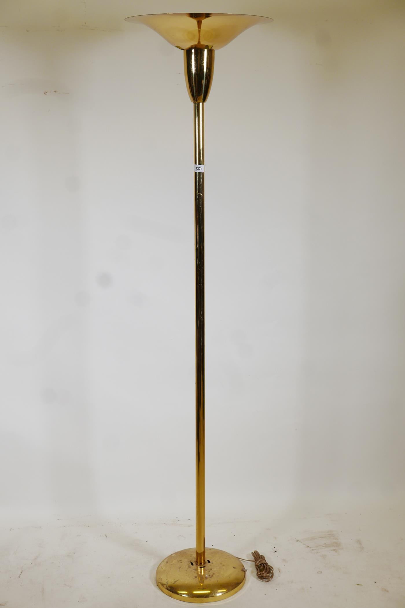 A brass uplighter, 70" high