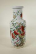 A Chinese polychrome porcelain Rouleau vase with enamelled peach tree decoration, 18" high
