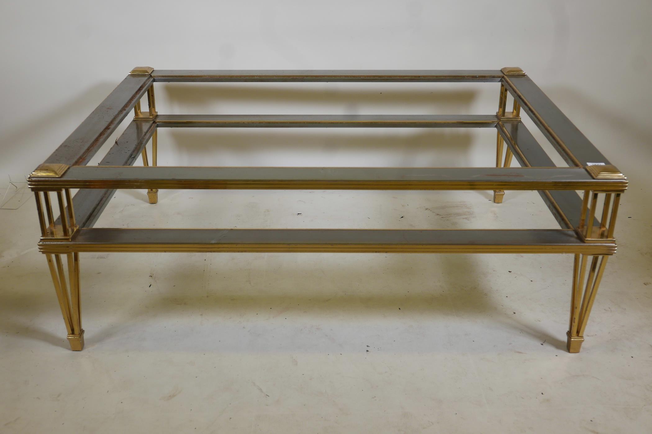 A 'Hollywood Regency' brushed steel and brass two tier occasional table in the manner of Zevi,