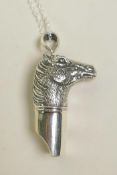 A sterling silver pendant whistle in the form of a horse head, 1½"