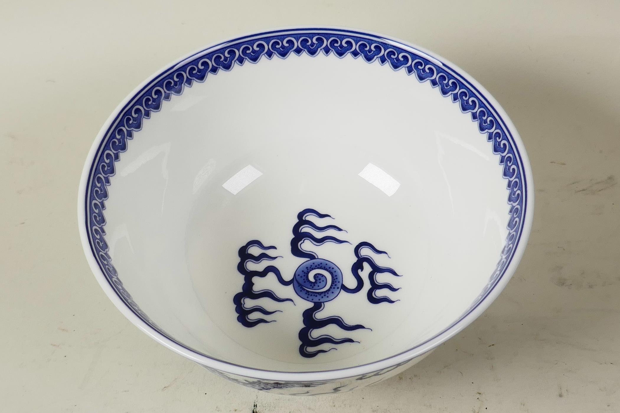 A Chinese blue and white porcelain bowl decorated with dragons chasing the flaming pearl, 6 - Image 2 of 3