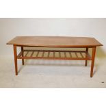 A 1970s teak coffee table with a shaped top and slatted undertier, 47" x 22", 18" high