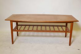 A 1970s teak coffee table with a shaped top and slatted undertier, 47" x 22", 18" high