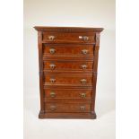 A Continental burr elm Welllington chest of six graduated drawers with brass drop handles and rib