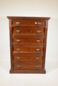 A Continental burr elm Welllington chest of six graduated drawers with brass drop handles and rib