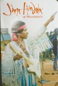 A Jimi Hendrix at Woodstock poster from the film of the same name, together with The Who's