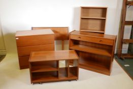 A 1970s teak chest of three drawers, a teak bookcase with single drawer, a teak trolley, an open