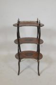 A C19th inlaid walnut kidney shaped three tier etagere inlaid with scrolls and flowers, AF, 32"