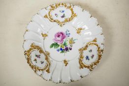 A mid C19th Meissen 'B-Form' Rococo style porcelain charger, scallop shaped with gilt highlights and