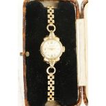 A ladies' 9ct gold cased Rodania wristwatch on a 9ct gold link bracelet (total 14 grams)
