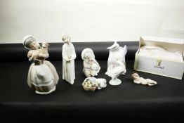 A collection of six Lladro collector's items; Baby Jesus, no.14535, Eskimo child with polar bear