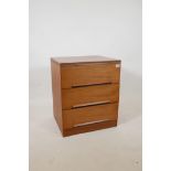 A 1960s/70s teak chest of three drawers by White & Newton, with distinctive sloped handles