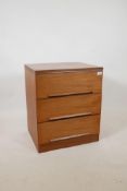 A 1960s/70s teak chest of three drawers by White & Newton, with distinctive sloped handles