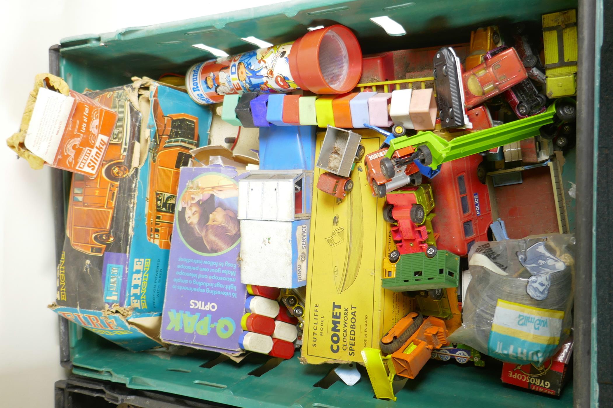 A collection of vintage child's toys to include tin plate cars, slinkys, magic painting books etc, - Image 3 of 7