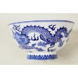 A Chinese blue and white porcelain bowl decorated with dragons chasing the flaming pearl, 6