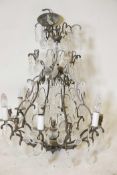 An iron and crystal drop chandelier, 26" high, 23" diameter